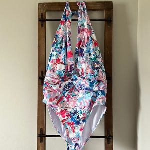 Beach Joy one piece print bathing suit. Twist front. Halter.